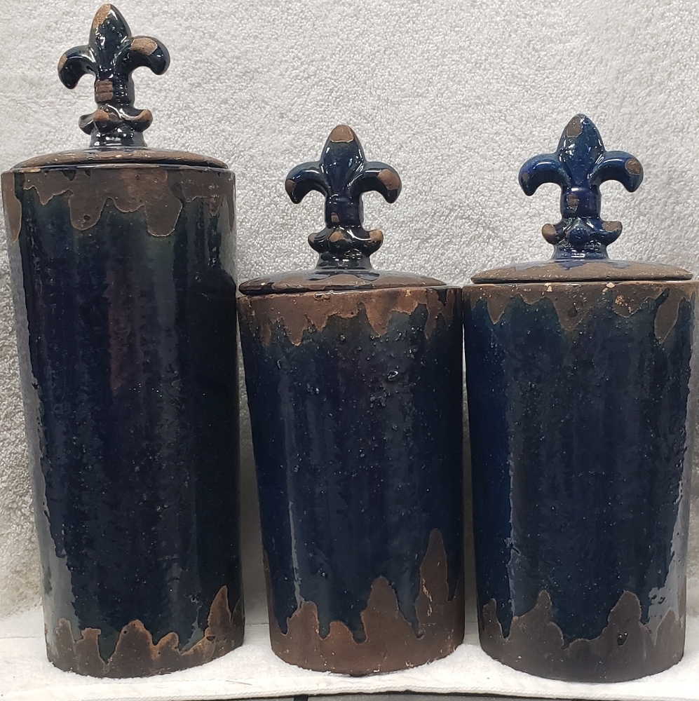 Set of three blue canisters with lids